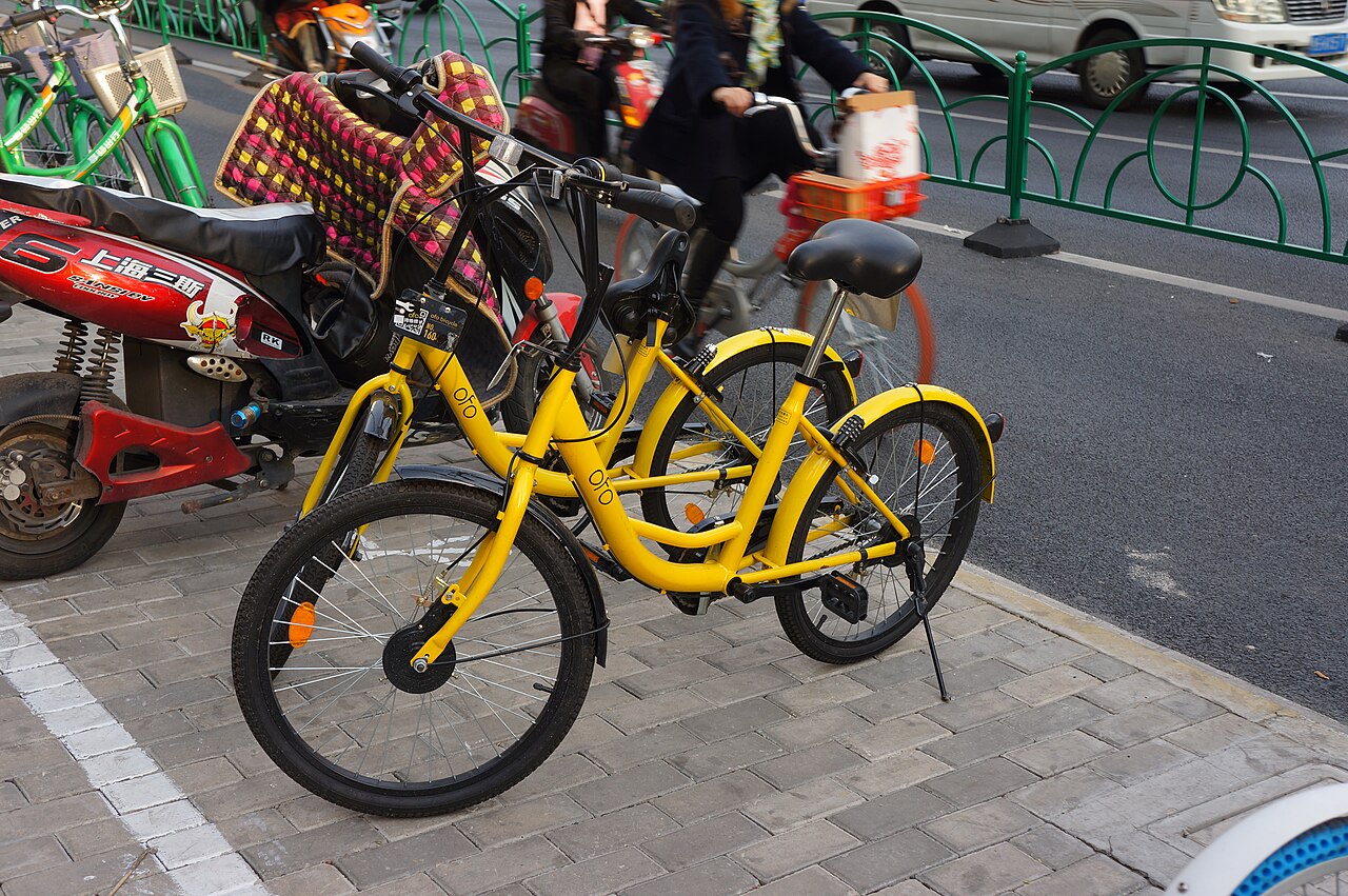 Yellow shared bicycles parked near Jiangning Road Station in Shanghai, photographed in March 2017 by MNXANL